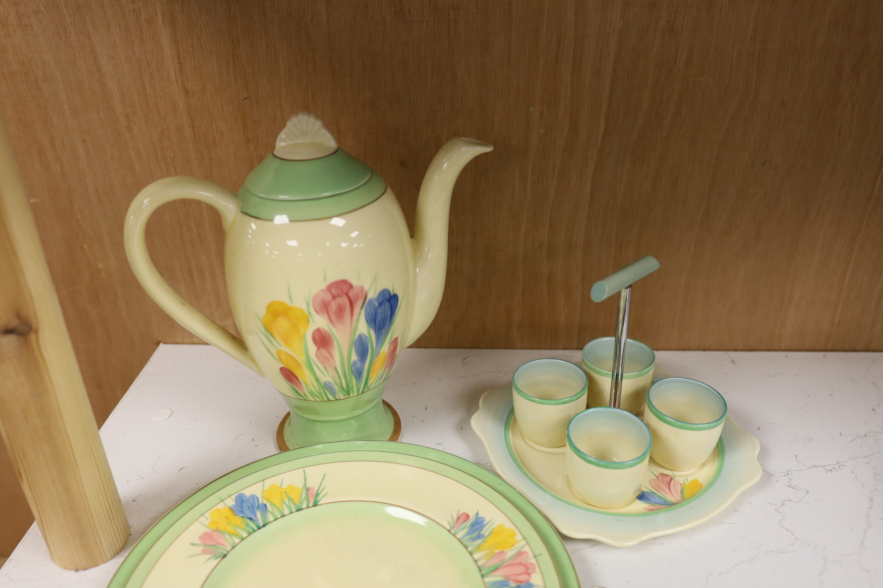 A Clarice Cliff 'Spring Crocus' pattern teapot, plates etc (5)